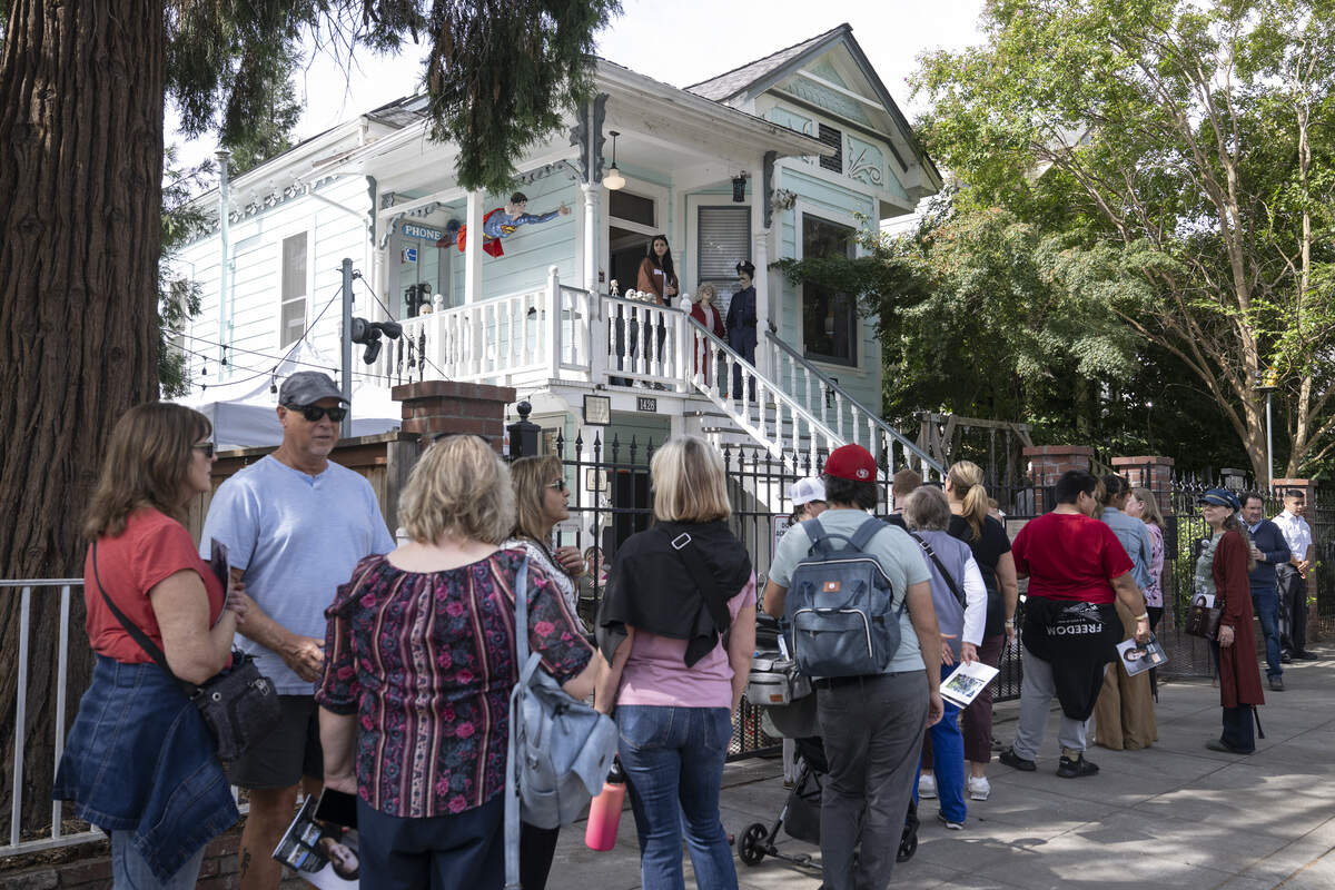 Visitors line up to visit the former home of serial killer Dorothea Puente, now known as The Innocent House, during Preservation Sacramento’s annual historic home tour in Sacramento on Sunday. Puente, who operated the home as a boarding house, murdered nine of the home’s lodgers and buried them in the yard in the 1980s.